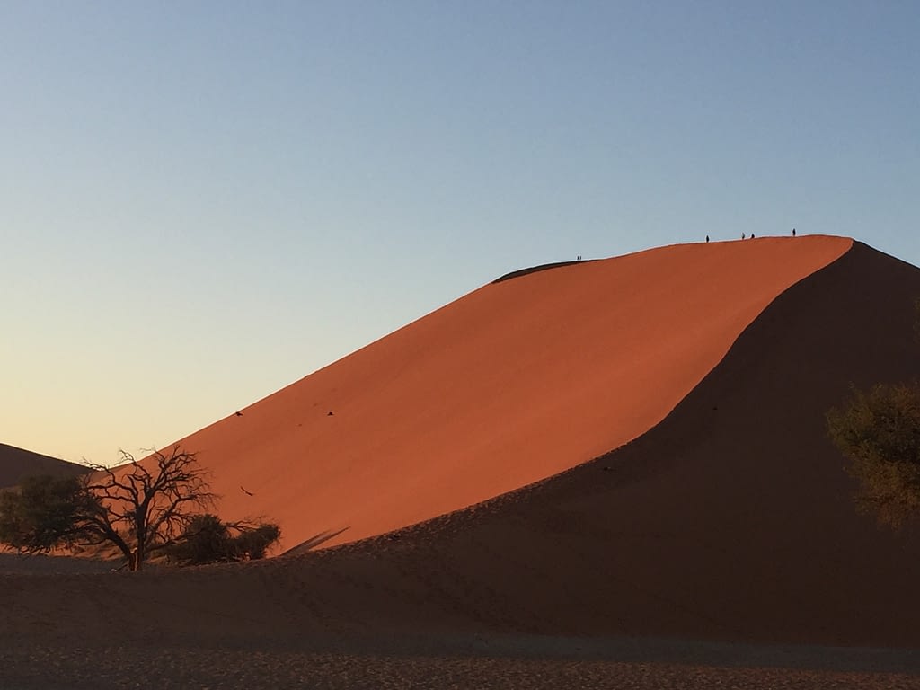Dune 45 at sunrise with the side glowing red
